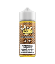 Bottle of Loaded E‑Liquid 120 ml labeled “Nutty Choco Crepe” featuring rich brown and creamy beige packaging with illustrations of a chocolate-filled crepe and nut pieces, accompanied by flavor notes “Apple Fritter, Lemon Bar, Melon Milkshake” in stylized lettering—designed for vape devices.